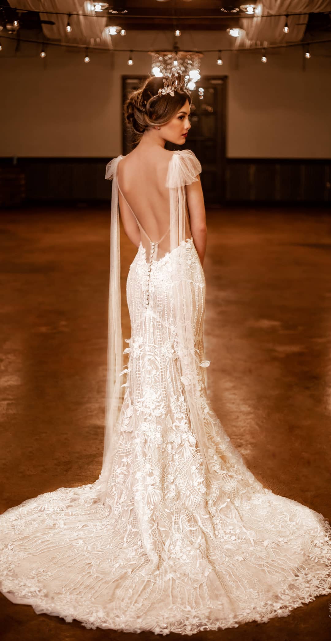 Carlotta laceThe base is an ivory tulle, which has been embroidered with a floral design, much of which has been corded and embellished with 3 D flowers, beads and sequins.