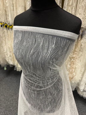 Elfenbeinfarbener Glitzertüll - Wellenmuster (CF)