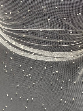 Elfenbeinperlen-Tüll – Synchronisierung