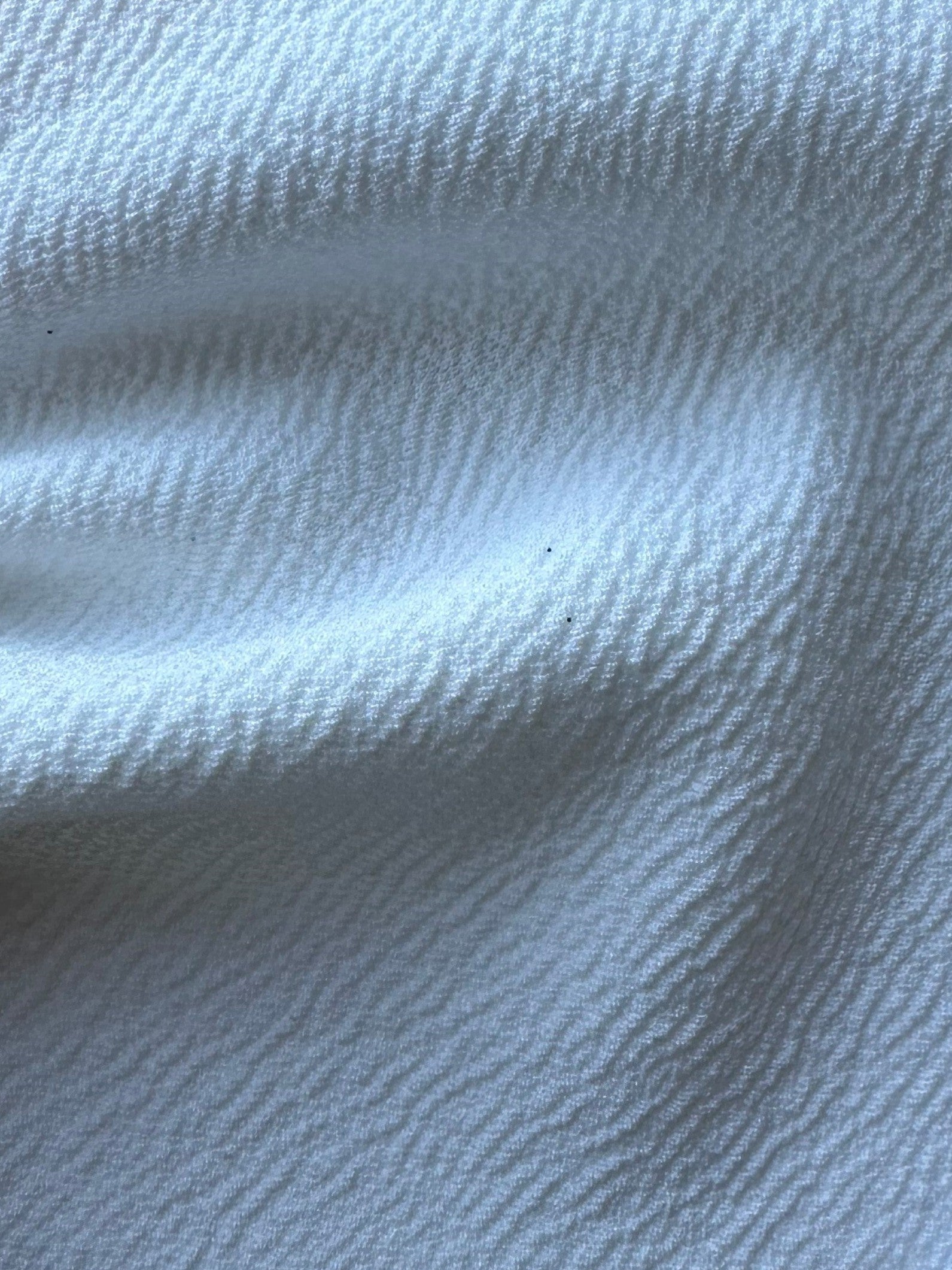 Elfenbeinfarbener, schwerer Polyester-Krepp mit Stretchanteil – Spanien