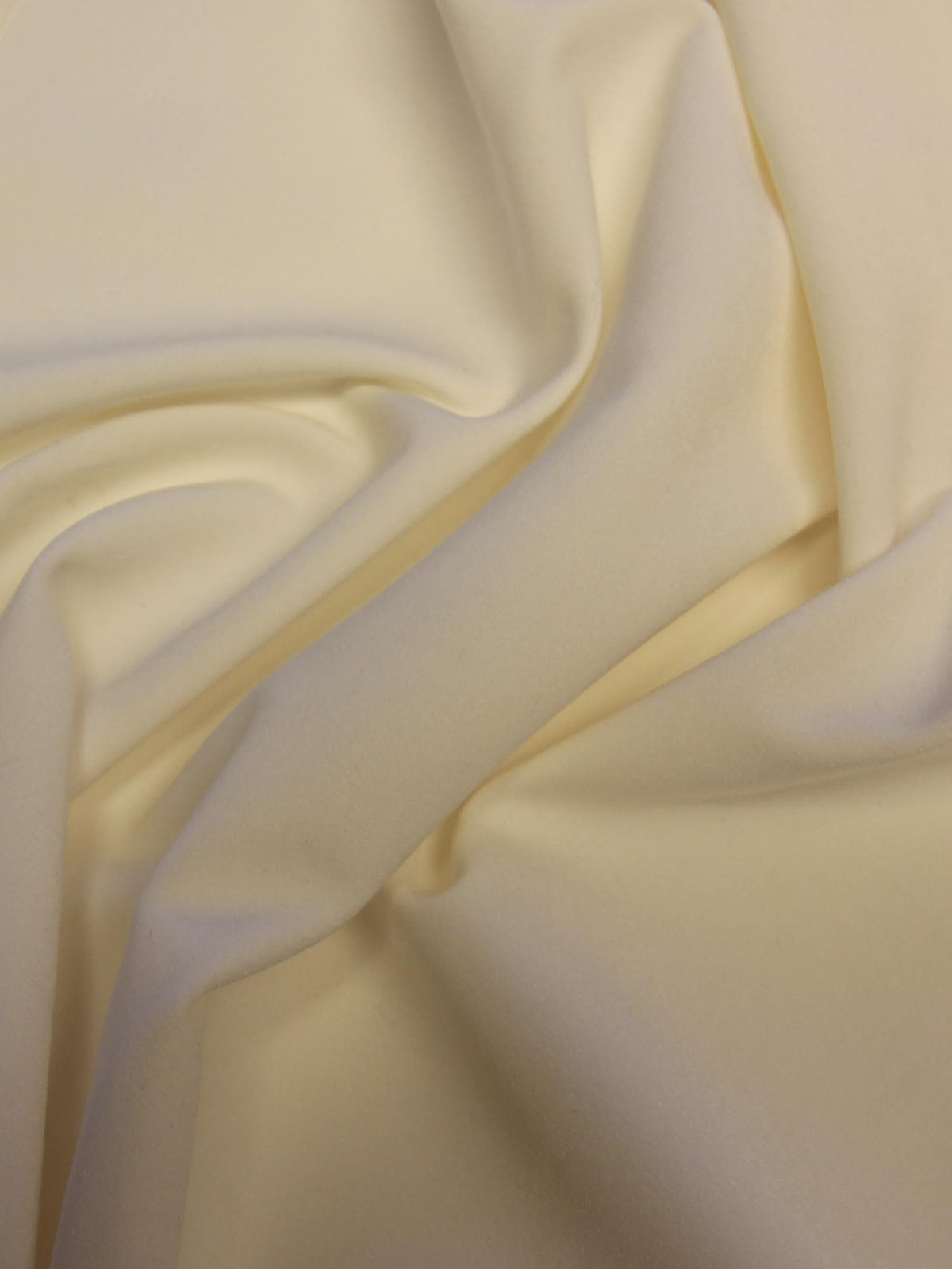 Elfenbeinfarbener Polyester-Stretch-Krepp – Compassion